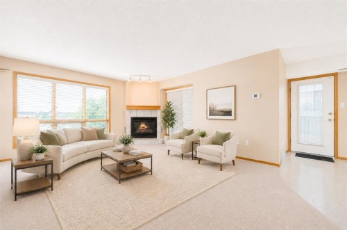 4-407 Macleod Trail Se, Medicine Hat, AB - Indoor Photo Showing Living Room With Fireplace