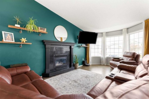 453 Stark Way Se, Medicine Hat, AB - Indoor Photo Showing Living Room With Fireplace
