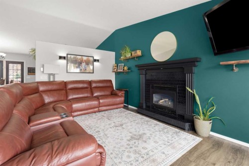 453 Stark Way Se, Medicine Hat, AB - Indoor Photo Showing Living Room With Fireplace