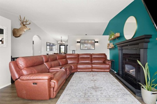 453 Stark Way Se, Medicine Hat, AB - Indoor Photo Showing Living Room With Fireplace