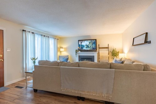2339 20 Avenue Se, Medicine Hat, AB - Indoor Photo Showing Living Room With Fireplace
