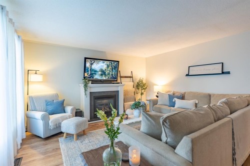 2339 20 Avenue Se, Medicine Hat, AB - Indoor Photo Showing Living Room With Fireplace