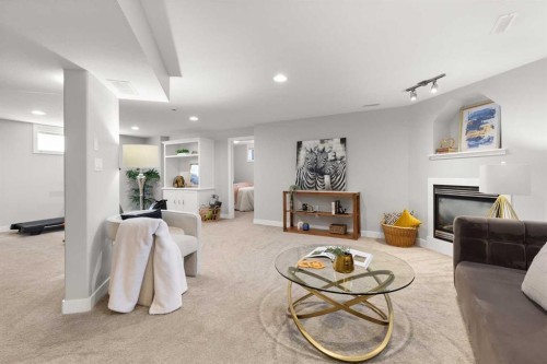 440 Spruce Way Se, Medicine Hat, AB - Indoor Photo Showing Living Room With Fireplace