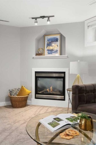 440 Spruce Way Se, Medicine Hat, AB - Indoor Photo Showing Living Room With Fireplace