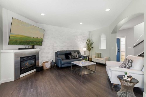 440 Spruce Way Se, Medicine Hat, AB - Indoor Photo Showing Living Room With Fireplace