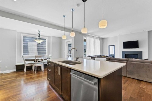 42 Somerset Link Se, Medicine Hat, AB - Indoor Photo Showing Kitchen With Fireplace With Double Sink With Upgraded Kitchen