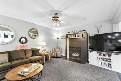 612 Sangster Crescent Sw, Redcliff, AB - Indoor Photo Showing Living Room With Fireplace