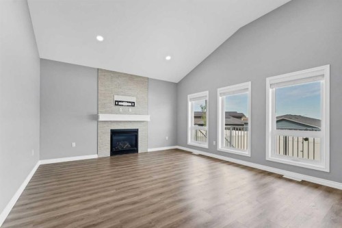 127 Hamptons Crescent Se, Medicine Hat, AB - Indoor Photo Showing Living Room With Fireplace