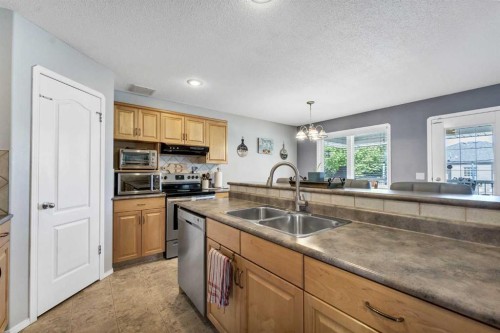 369 Stratton Way Se, Medicine Hat, AB - Indoor Photo Showing Kitchen With Double Sink