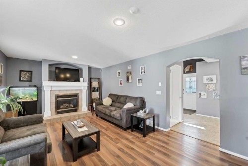 369 Stratton Way Se, Medicine Hat, AB - Indoor Photo Showing Living Room With Fireplace