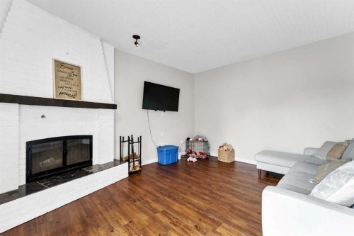 45 Cooper Road Se, Medicine Hat, AB - Indoor Photo Showing Living Room With Fireplace