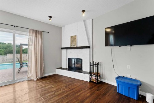 45 Cooper Road Se, Medicine Hat, AB - Indoor Photo Showing Living Room With Fireplace