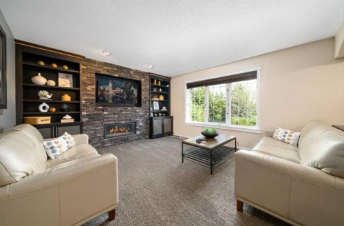 633 Spruce Way Se, Medicine Hat, AB - Indoor Photo Showing Living Room With Fireplace