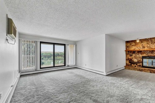 211-1051 3 Street Nw, Medicine Hat, AB - Indoor With Fireplace