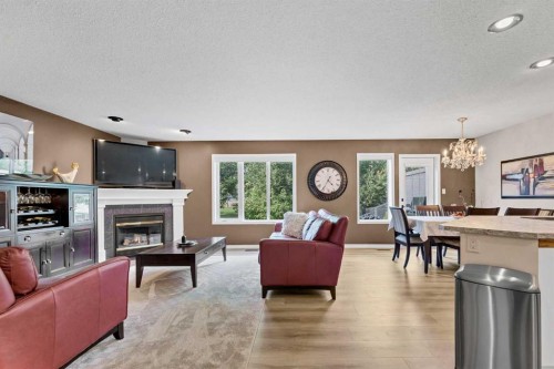 1A Stonegate Crescent Se, Medicine Hat, AB - Indoor Photo Showing Living Room With Fireplace