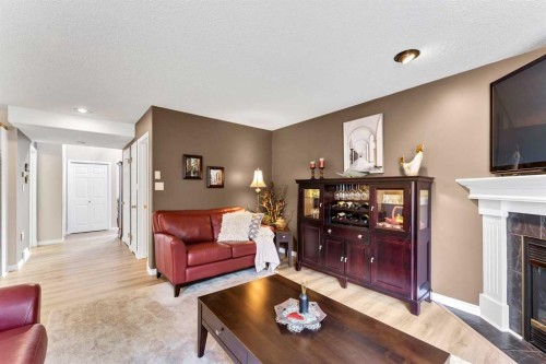 1A Stonegate Crescent Se, Medicine Hat, AB - Indoor Photo Showing Living Room With Fireplace