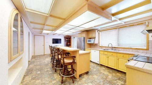 209 2 Avenue, Burdett, AB - Indoor Photo Showing Kitchen With Double Sink