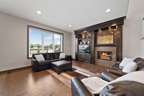 38 Sterling Link Se, Medicine Hat, AB - Indoor Photo Showing Living Room With Fireplace