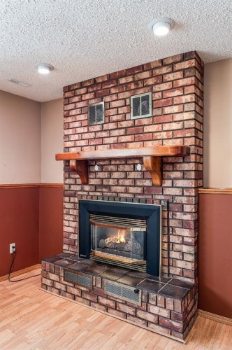 80 Carry Crescent Se, Medicine Hat, AB - Indoor Photo Showing Living Room With Fireplace