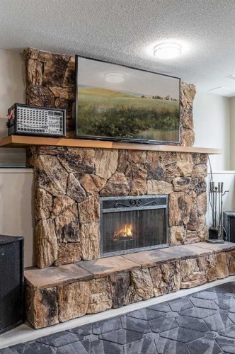 73 Cooper Road Se, Medicine Hat, AB - Indoor Photo Showing Other Room With Fireplace