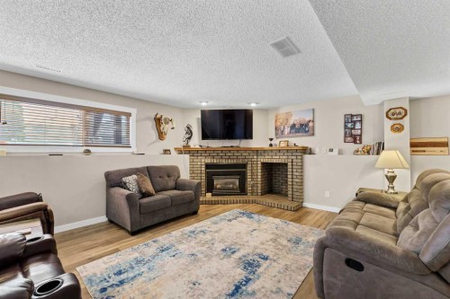 29 Rice Drive Se, Medicine Hat, AB - Indoor Photo Showing Living Room With Fireplace