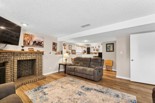 29 Rice Drive Se, Medicine Hat, AB - Indoor Photo Showing Living Room With Fireplace