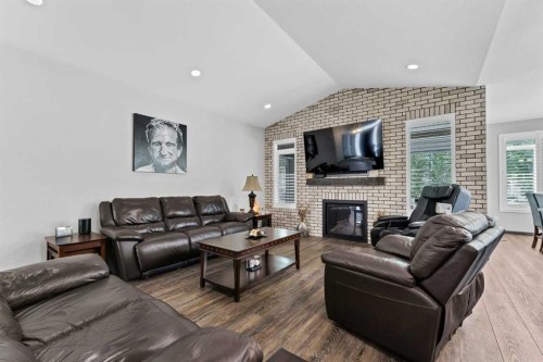 215 Hamptons Crescent Se, Medicine Hat, AB - Indoor Photo Showing Living Room With Fireplace