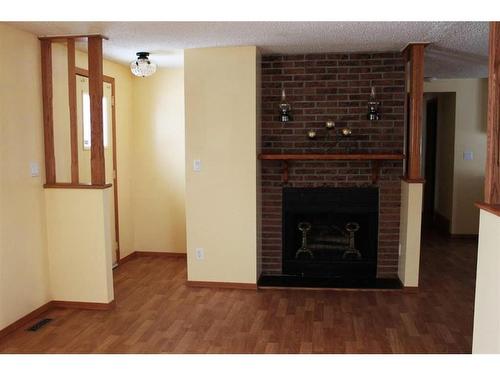700 8 Street, Fox Creek, AB - Indoor Photo Showing Living Room With Fireplace