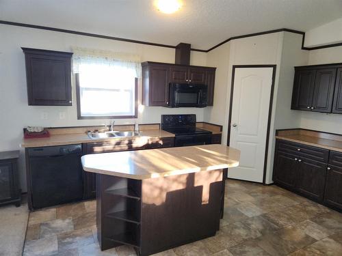 225 5Th Street, Fox Creek, AB - Indoor Photo Showing Kitchen With Double Sink