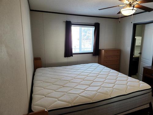 225 5Th Street, Fox Creek, AB - Indoor Photo Showing Bedroom