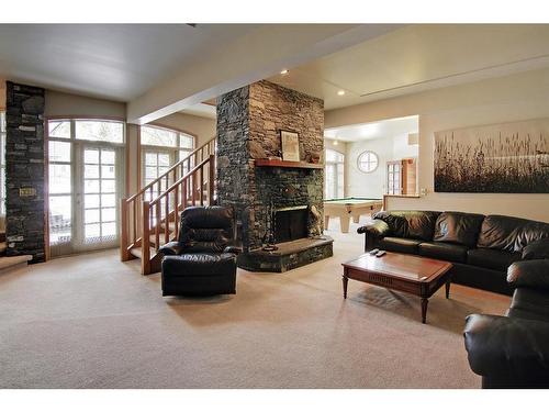 4 Cascade Court, Banff, AB - Indoor Photo Showing Living Room With Fireplace