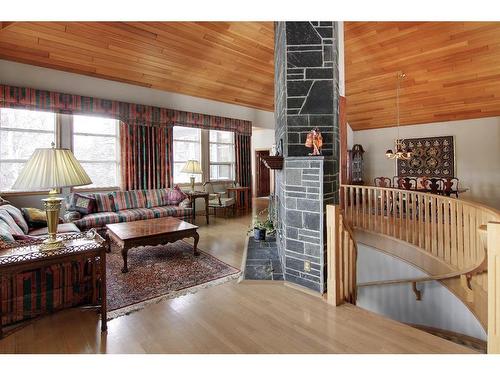 4 Cascade Court, Banff, AB - Indoor Photo Showing Living Room With Fireplace