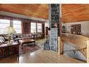 4 Cascade Court, Banff, AB  - Indoor Photo Showing Living Room With Fireplace 