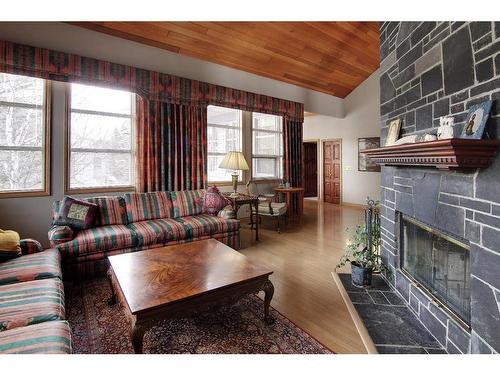 4 Cascade Court, Banff, AB - Indoor Photo Showing Living Room With Fireplace