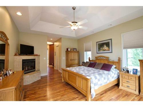 102 Appleyard Cove, Hinton, AB - Indoor Photo Showing Bedroom With Fireplace