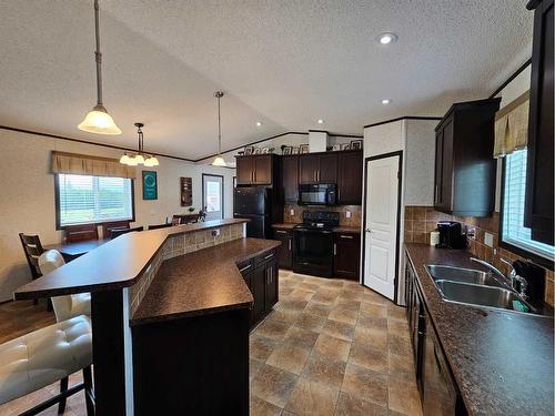 106, 590079 Range Road 113, Rural Woodlands County, AB - Indoor Photo Showing Kitchen With Double Sink