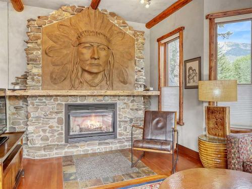 701 Mallard Alley, Canmore, AB - Indoor Photo Showing Living Room With Fireplace