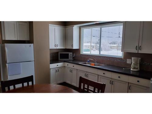 4903-4915 Chalmers Avenue, Swan Hills, AB - Indoor Photo Showing Kitchen With Double Sink