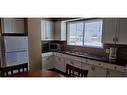 4903-4915 Chalmers Avenue, Swan Hills, AB  - Indoor Photo Showing Kitchen With Double Sink 