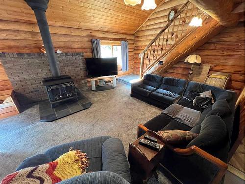 50423A Highway 16, Rural Yellowhead County, AB - Indoor Photo Showing Living Room With Fireplace