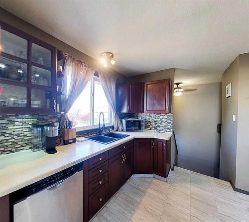 712 3 Avenue, Fox Creek, AB - Indoor Photo Showing Kitchen With Double Sink