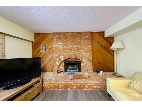 1214 50 Street, Edson, AB - Indoor Photo Showing Living Room With Fireplace