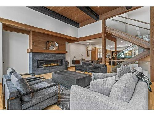 A-290 Three Sisters Drive, Canmore, AB - Indoor Photo Showing Living Room With Fireplace