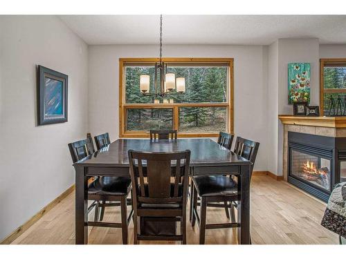 511-80 Dyrgas Gate, Canmore, AB - Indoor Photo Showing Dining Room With Fireplace