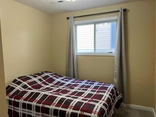 407 Hammond Drive, Fox Creek, AB - Indoor Photo Showing Bedroom