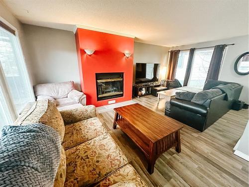 29 Chaisson Crossing, Whitecourt, AB - Indoor Photo Showing Living Room With Fireplace