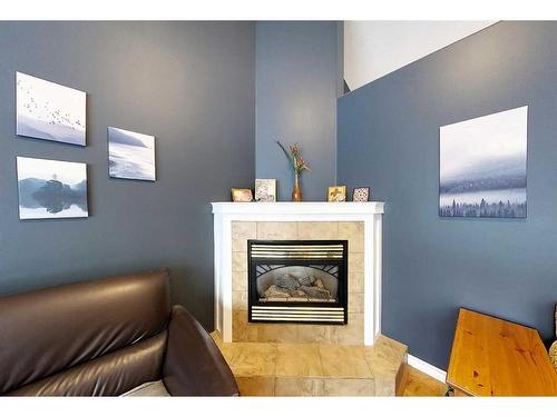 6301 19 Avenue, Edson, AB - Indoor Photo Showing Living Room With Fireplace