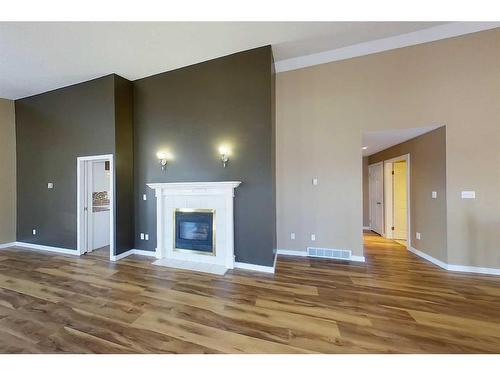 3-300 12 Avenue Sw, Slave Lake, AB - Indoor Photo Showing Living Room With Fireplace