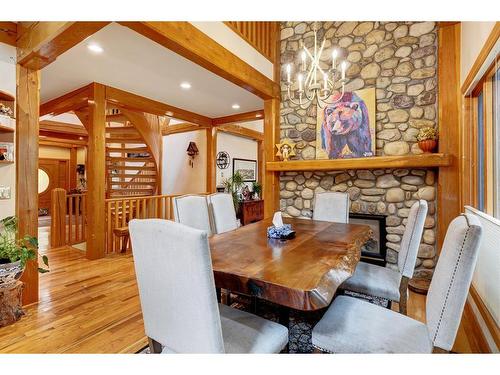 106 Lougheed Circle, Banff, AB - Indoor Photo Showing Dining Room With Fireplace
