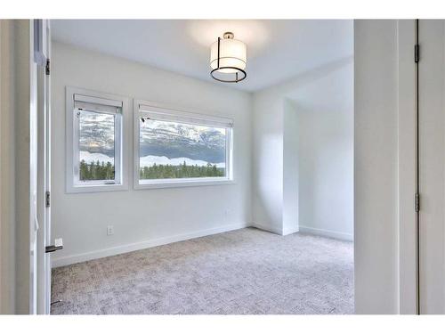 64-209 Stewart Creek Rise, Canmore, AB - Indoor Photo Showing Other Room